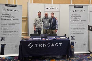AED summit exhibitor booth for TRNSACT finance software team